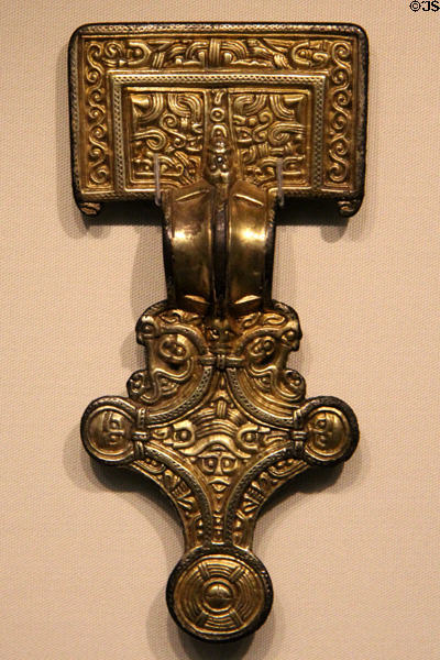 Anglo-Saxon gilt silver square-head brooch with scalloped border (early 6thC) from Isle of Wight at British Museum. London, United Kingdom.