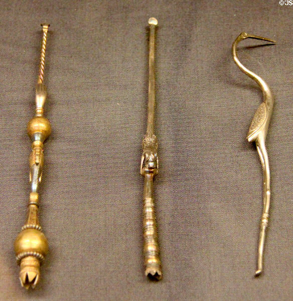 Roman era silver personal care tools: 2 brushes for teeth or cosmetics & one ibis-shaped tooth pick from three English sites at British Museum. London, United Kingdom.