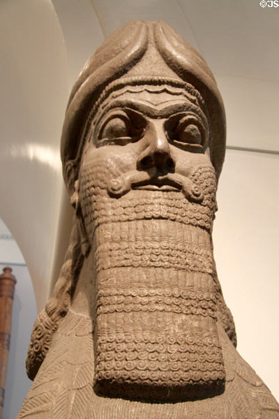 Facial detail of Assyrian human-headed winged lion (c865-860 BCE) guarding doorway of North-West Palace from Nimrud at British Museum. London, United Kingdom.