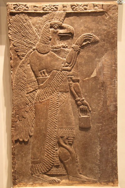 Assyrian eagle-headed protective spirit (c865-860 BCE) guarding doorway of Temple of Ninurta from Nimrud at British Museum. London, United Kingdom.