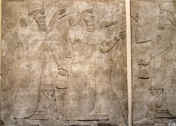 Assyrian carved panel portrays King Ashurnasirpal II under divine protection (c883-859 BCE) from North-West Palace of Nimrud at British Museum. London, United Kingdom.