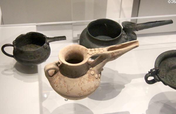 Spouted bronze jars riveted together plus pottery imitations with clay pellets mimicking rivets (9th-8thC BCE) excavated from western Iran at British Museum. London, United Kingdom.