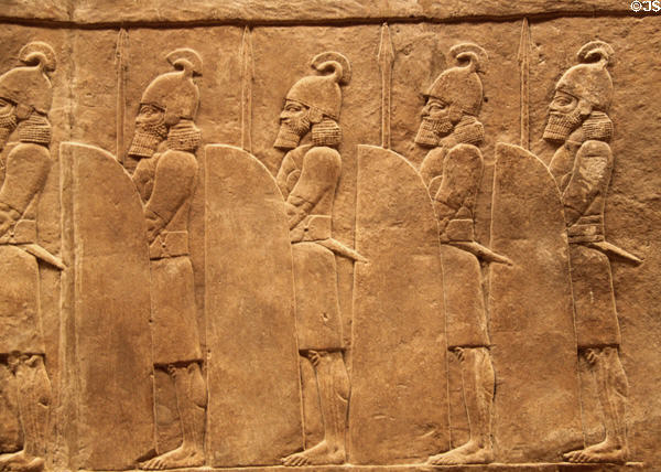 Assyrian carved panel shows shielded guards during lion hunt (c645-635 BCE) from North Palace of Nineveh at British Museum. London, United Kingdom.