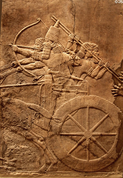 Assyrian carved panel shows lion hunt by chariot (c645-635 BCE) from North Palace of Nineveh at British Museum. London, United Kingdom.