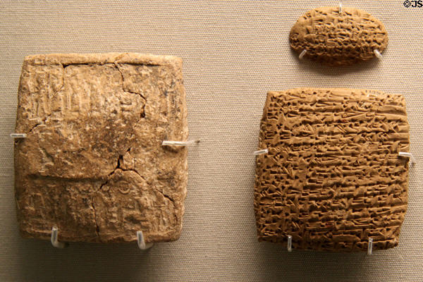 Cuneiform letter plus a small addendum & their clay envelope at British Museum. London, United Kingdom.