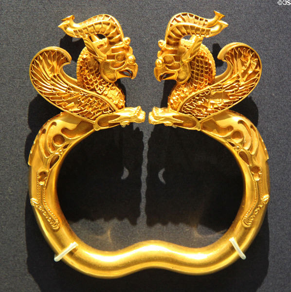 Ancient Iranian Achaemenid culture gold armlets of winged monsters with griffin heads (5thC-4thC BCE) found in Oxus River Treasure, Tajikistan at British Museum. London, United Kingdom.