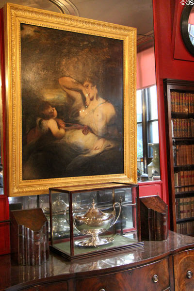 Snake in the Grass; or Love unloosing the zone of Beauty painting (1785) by Sir Joshua Reynolds over silver collection in library at Sir John Soane's Museum. London, United Kingdom.
