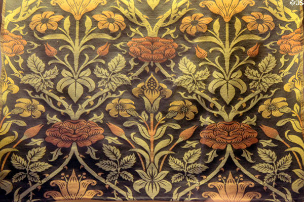 Rose & Lily woven silk & wool fabric (1893) by John Henry Dearle at Morris Gallery. London, United Kingdom.