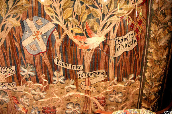 Detail of embroidered wall hanging (c1900) by Morris & Co with needlework by client at Morris Gallery. London, United Kingdom.