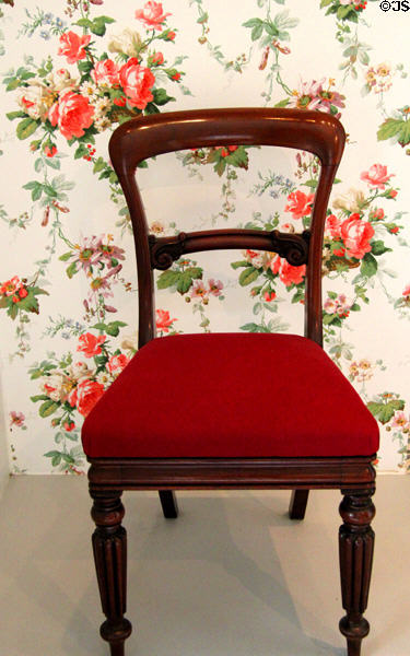 Non Arts & Crafts balloon-back chair & Rose Marie wallpaper typical of 1850s against which Morris was trying to make style inroads at Morris Gallery. London, United Kingdom.