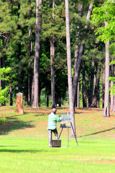 Sculpture of artist with easel on Langan Park grounds of Mobile Museum of Art. Mobile, AL.