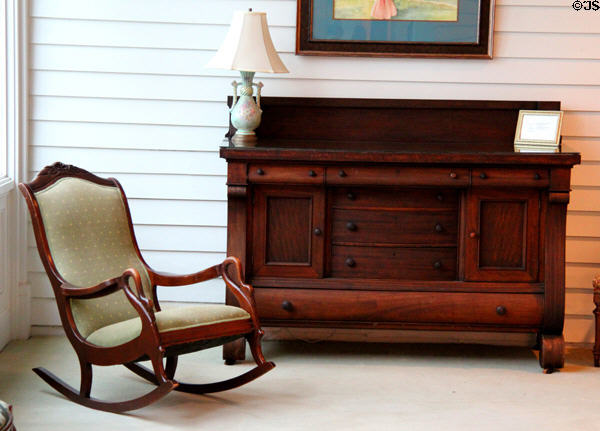 Rocking chair with swan handles & sideboard at Bragg-Mitchell Mansion. Mobile, AL.