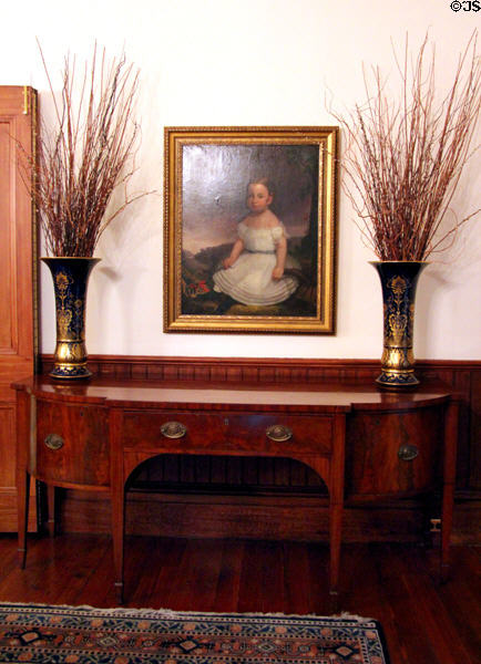 Sideboard under portrait at Bragg-Mitchell Mansion. Mobile, AL.