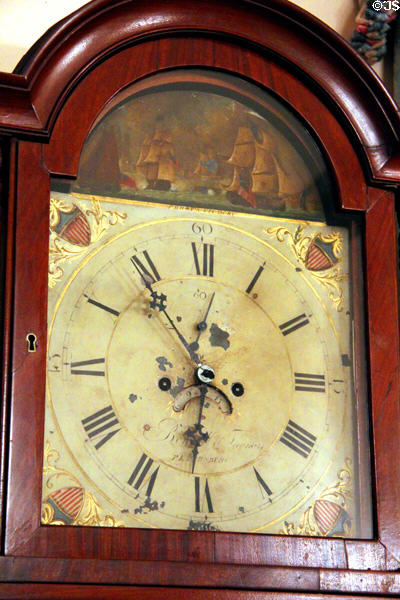 Face detail shows Perry's Victory & American shields on tall case clock by Bennett & Thomas of Petersburg, VA at Bragg-Mitchell Mansion. Mobile, AL.