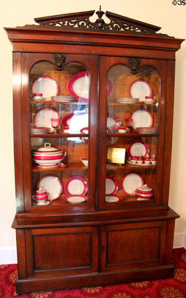 Cabinet with English Davenport China service at Conde-Charlotte Museum. Mobile, AL.