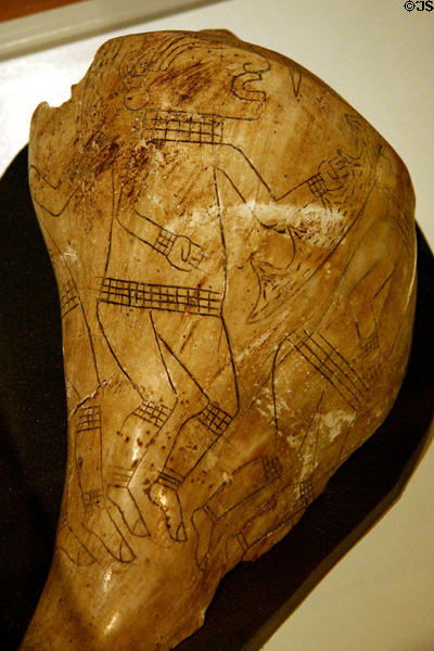 Engraved conch shell with three human figures (c1150-1450 CE) found Spiro Site, AR, at Old State House Museum. Little Rock, AR.