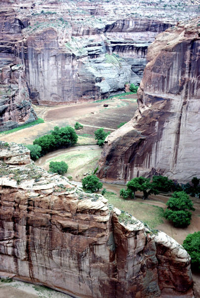 Canyon de Chelley National Monument river zigzags through cliffs. AZ.