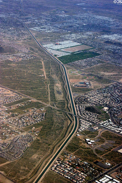 Canal through outskirts of Phoenix seen from air. Phoenix, AZ.