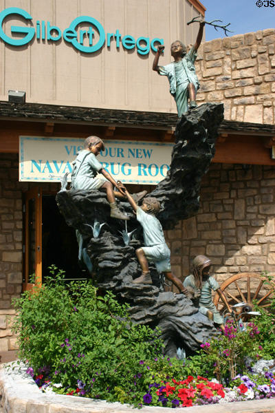 Sculpture of climbing children in front of crafts store in old town. Scottsdale, AZ.