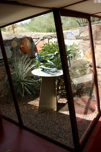 Small enclosed garden with sculpture through office windows at Taliesin West. Scottsdale, AZ.
