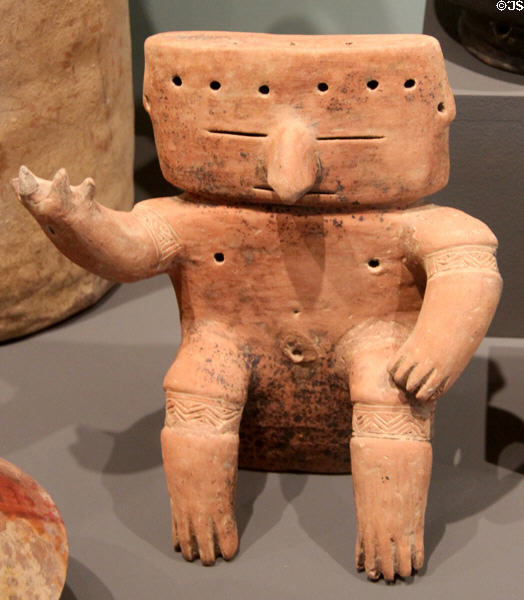 Tairona culture clay footed effigy vessel of flute player (900-1400 CE) from Colombia at Tucson Museum of Art. Tucson, AZ.