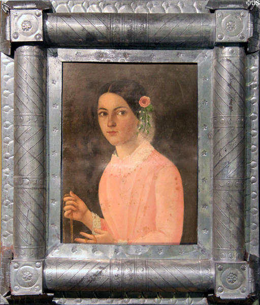 Portrait of woman in tin frame from Mexico (19thC) at Tucson Museum of Art. Tucson, AZ.