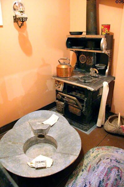 Bathtub beside cast iron wood burning cooking range at Arizona History Museum. Tucson, AZ.