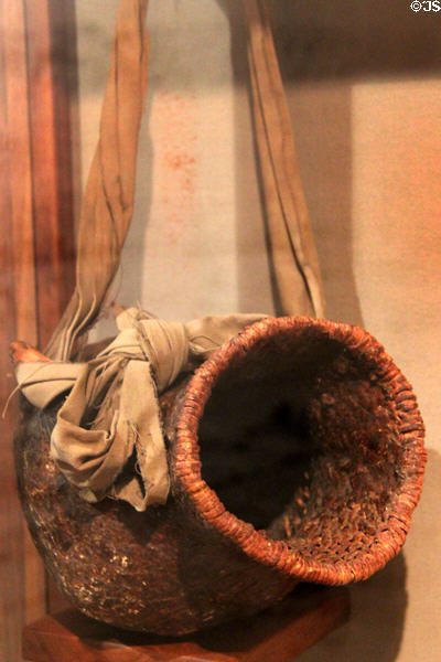 Apache water jug (tus) made of pitched basketry at Arizona Historical Society Museum Downtown. Tucson, AZ.