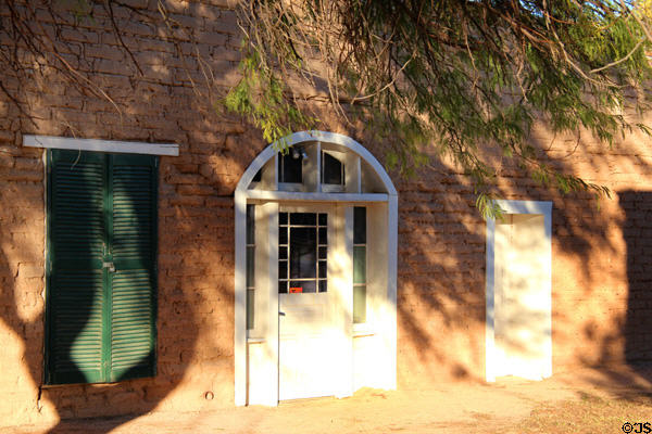 Reconstructed officer's house facade with doorway & windows in adobe wall at Fort Lowell. Tucson, AZ.