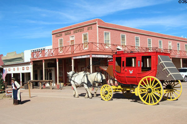 Stage coach passes Golden Eagle Brewery Saloon (1881) (420 Allen at 5th). Tombstone, AZ.