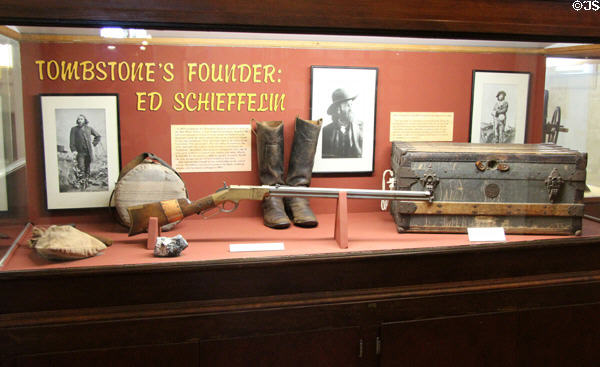 Ed Schieffelin, founder of Tombstone & discoverer of its first silver mine, display with photos, rifle, trunk, boots & canteen at Tombstone Courthouse Museum. Tombstone, AZ.