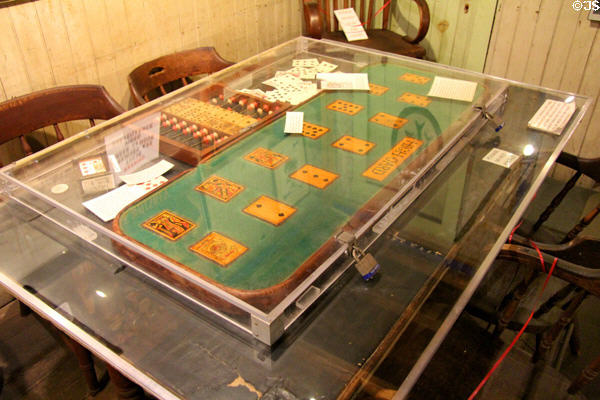 Original Faro gambling table where Doc Holliday played & beside which he fought duel with Johnny Ringo at Bird Cage Theatre. Tombstone, AZ.