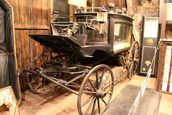 Black Moriah original Boothill hearse trimmed with pure gold & silver at Bird Cage Theatre. Tombstone, AZ.