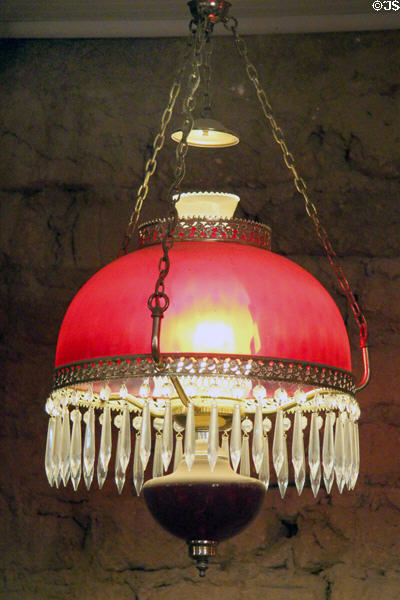 Ceiling oil lamp with red glass shade at Bird Cage Theatre. Tombstone, AZ.