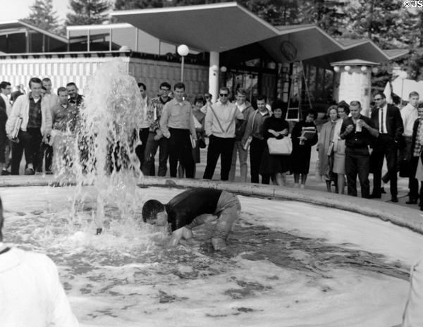 Hijinx in Ludwig's fountain at University of California Berkeley (1964). CA.