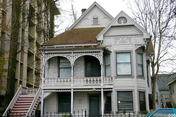 White Eastlake-style house (c1880) (1310-12 E St.). Sacramento, CA.