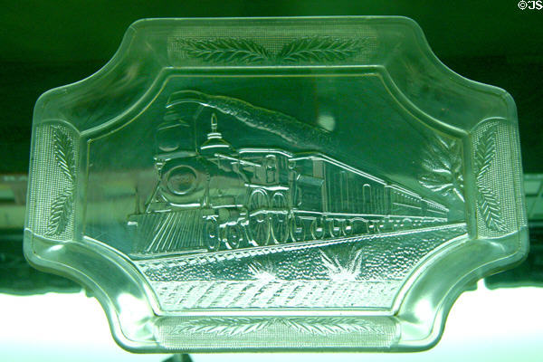 Green pressed glass commemorative tray with steam train at California State Railroad Museum. Sacramento, CA.