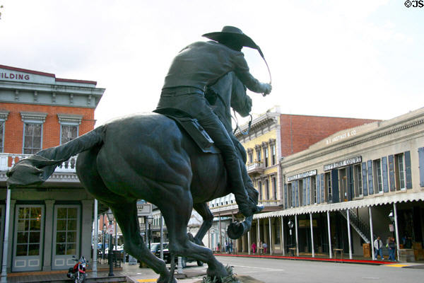 Pony Express monument gallops toward the B.F. Hastings Building, once Pony Express HQ (1006 2nd St.) in Old Sacramento. Sacramento, CA. On National Register.