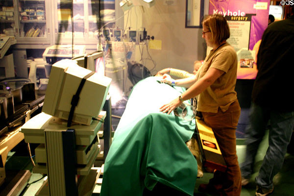 Tech Museum of Innovation visitors try hi-tech surgery. San Jose, CA.