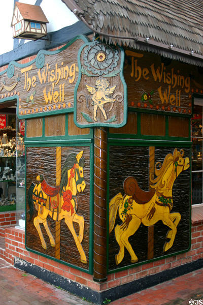 Store sign with carved carousel horses. Solvang, CA.