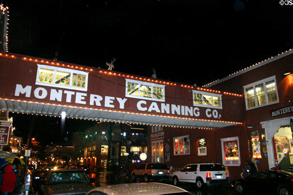 Night lights of Cannery Row old factories converted to tourist area. Monterey, CA.