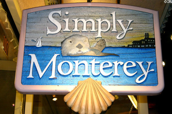 Carved sign showing otter on Cannery Row. Monterey, CA.