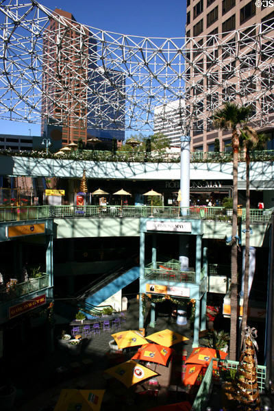 Shopping arcade under circular metal frame canopy at Ernst & Young Plaza. Los Angeles, CA.