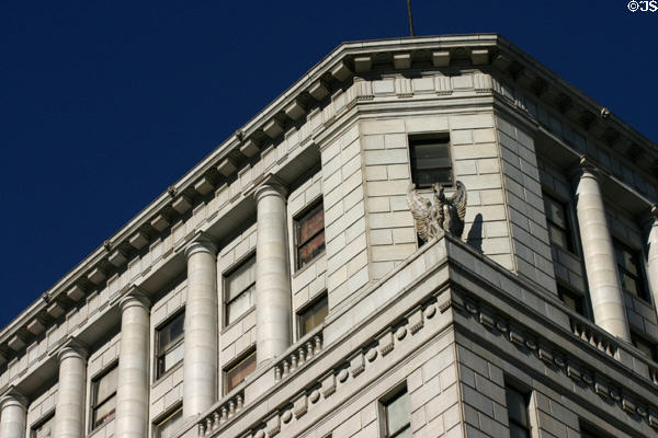 Gargoyle perches on Italianate building (NW corner of Main at 7th Streets). Los Angeles, CA.