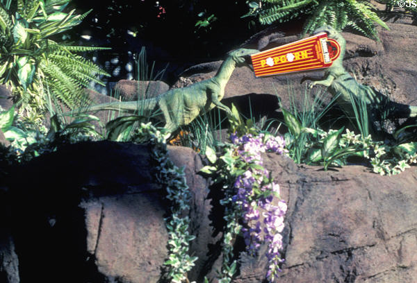 Two small dinosaurs fight over popcorn box on Jurassic Park ride at Universal Studios. Universal City, CA.