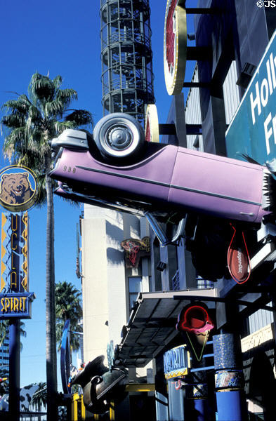 Fantasy world of pink convertibles embedded in freeway sign at Universal Studios CityWalk. Universal City, CA.