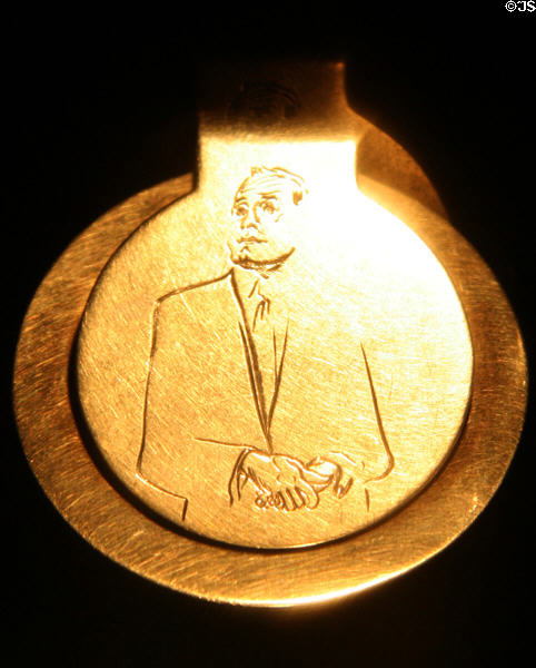 Gold money clip with caricature of Jack Benny given by him to Bob Crosby at LA County Natural History Museum. Los Angeles, CA.