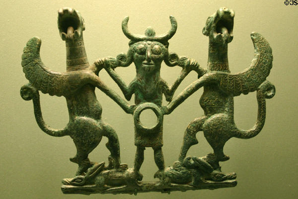 Iran: man with two winged horses of cheek plate from horse bit from Luristan (1000-650 BCE) at LACMA. Los Angeles, CA.
