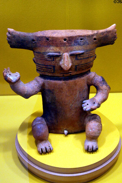 Columbian ceramic male figure with headdress (1000-1400) at LACMA. Los Angeles, CA.