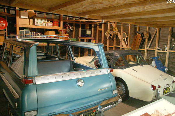 California garage display with Studebaker (1963) & Triumph (1958) at Petersen Automotive Museum. Los Angeles, CA.